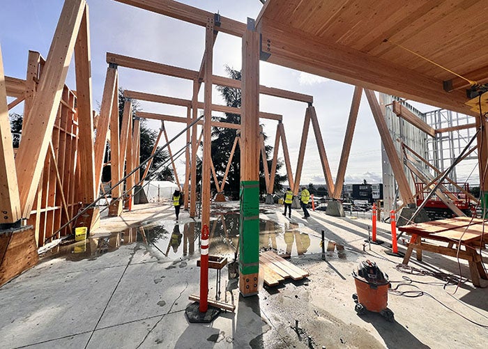 a building is being framed with wood