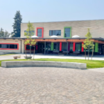 3 photos of newly completed school buildings