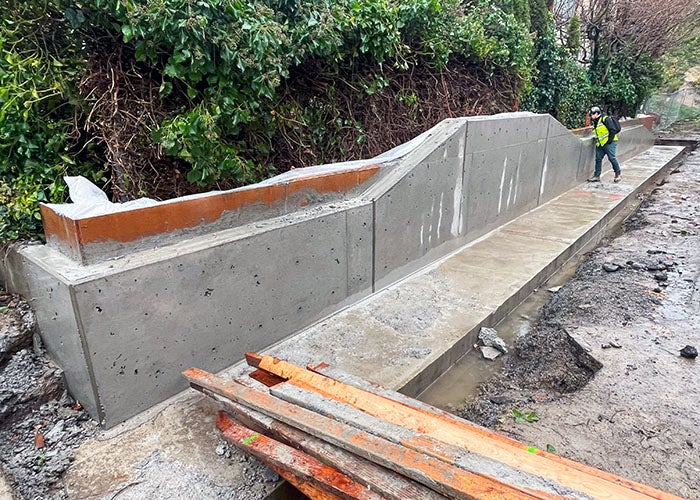 a concrete wall with a big footing