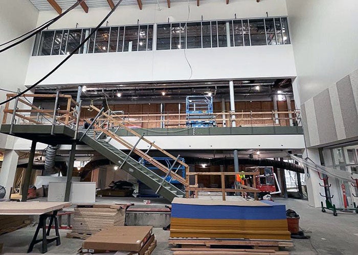 a three story wall has levels in a room under construction