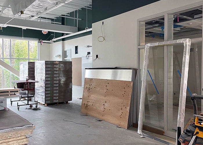 an interior space under construction with materials against a wall