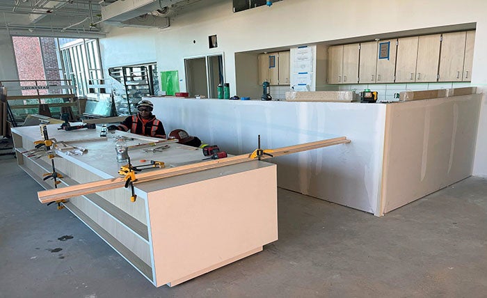 a room with cabinets being installed