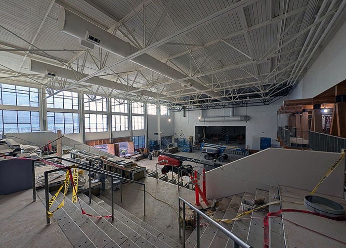 large room with wide stairs under construction