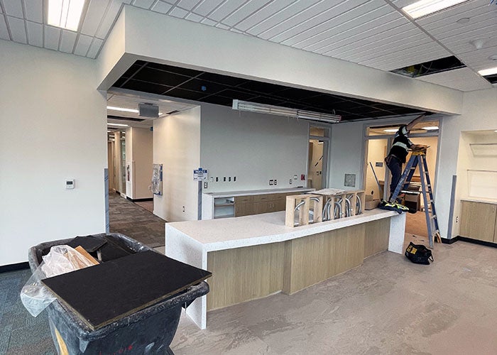 a room with a counter and a dropped ceiling