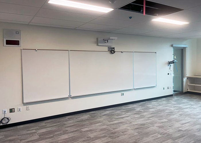 a wall with a whiteboard