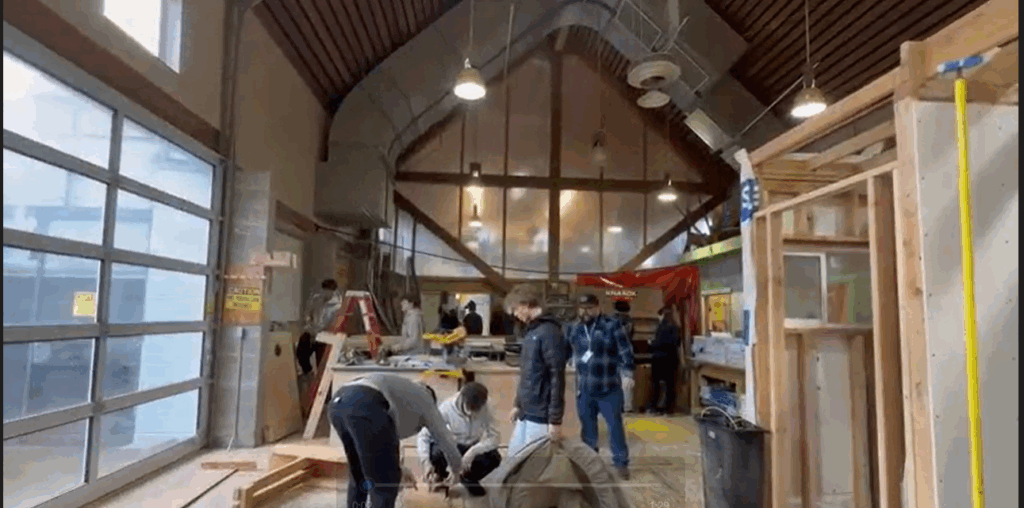 Students work on putting together a structure in a carpentry classroom