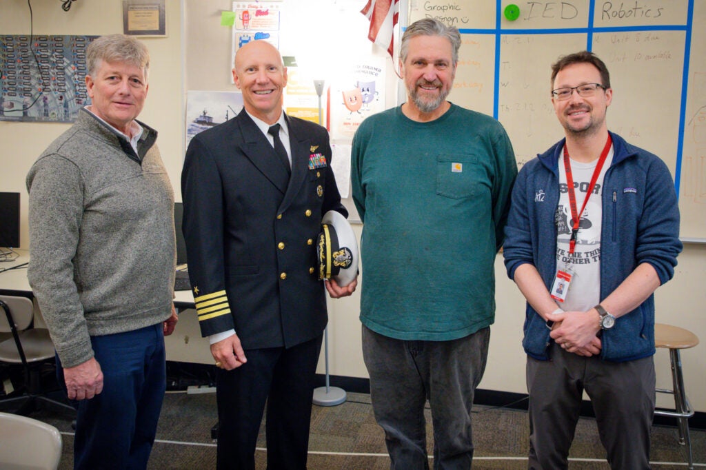 CTE teachers and navy captain in classroom