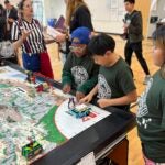 SPS Students Dig into STEM at First LEGO League Robotics Competition
