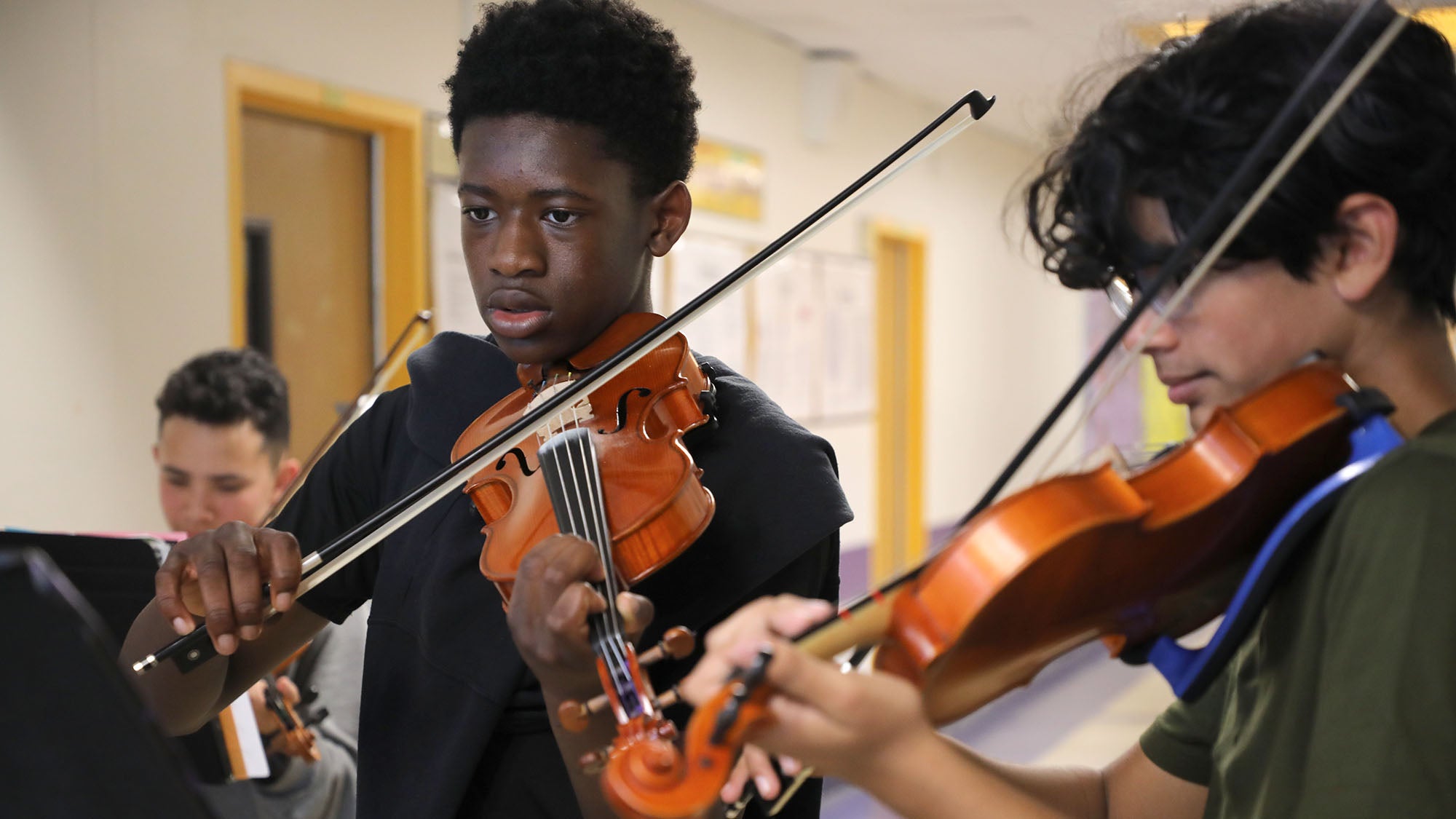 Washington Middle School students playing violins