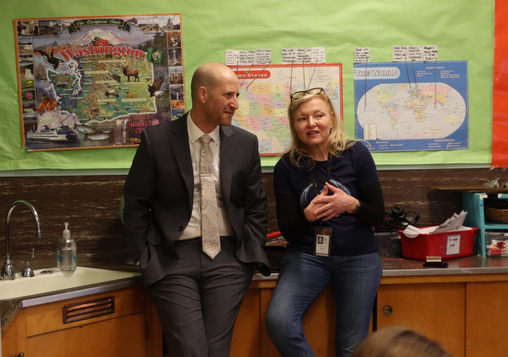 Seattle Public Schools Superintendent Ben Shuldiner speaks with Lafayette Elementary teacher Lisa Duke during his tour of the school in February. The superintendent is more than halfway through his goal of visiting all 106 schools in the district. He’s on track to finish touring schools in early May.