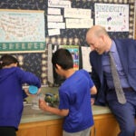 Superintendent Shuldiner with two Decatur students