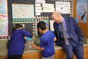 Superintendent Shuldiner with two Decatur students