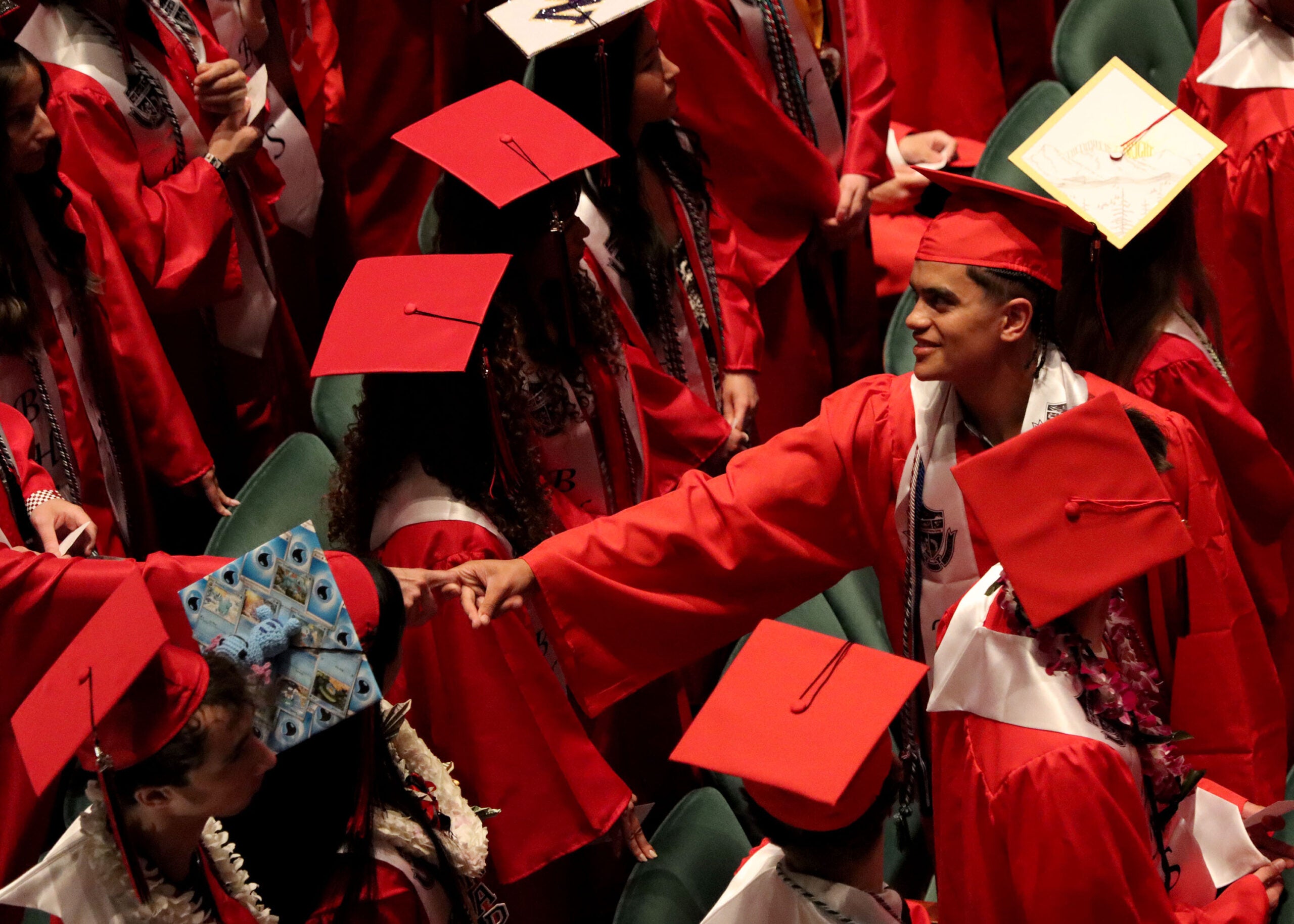 Graduation Ballard Students Shaking hands in audience