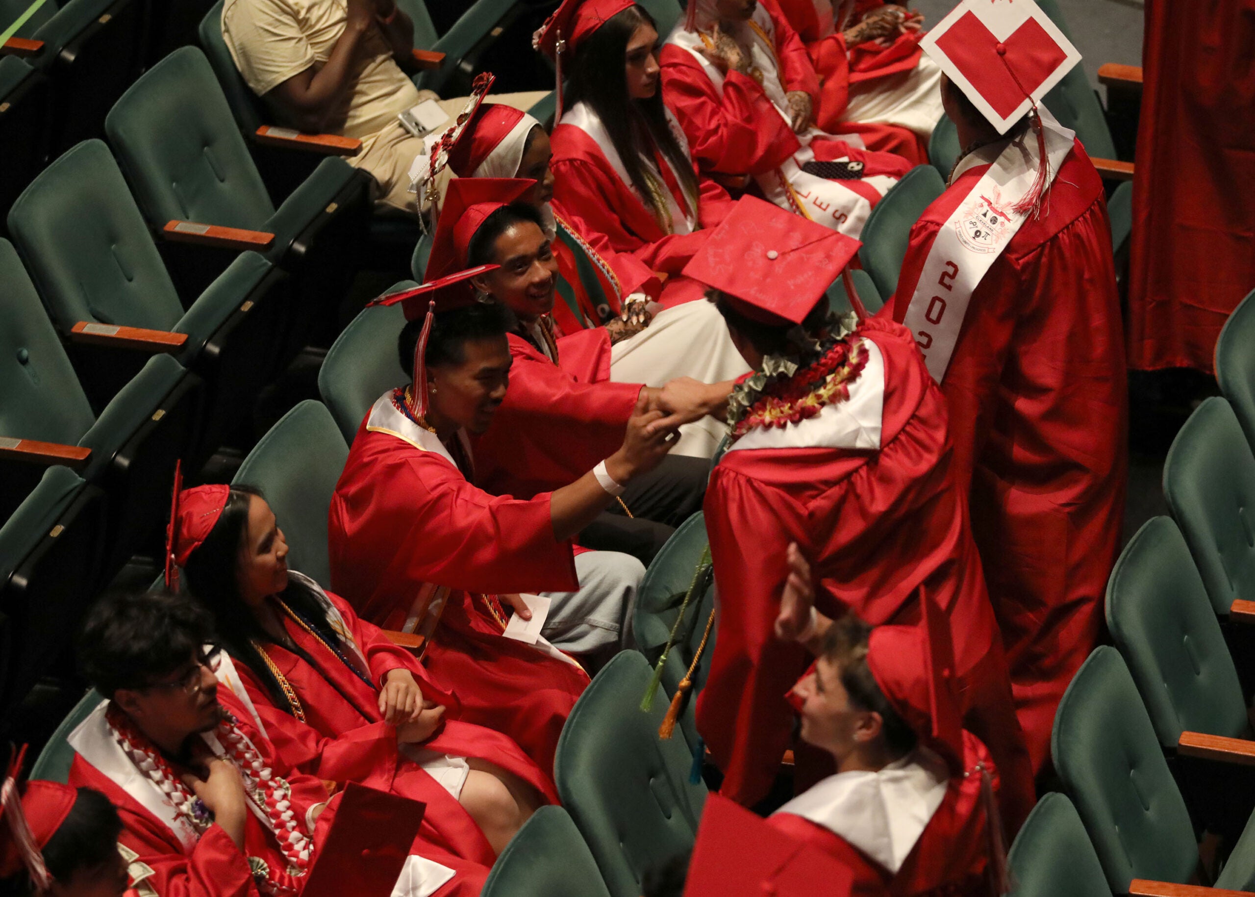 Graduation Cleveland Students shaking hands in the audience