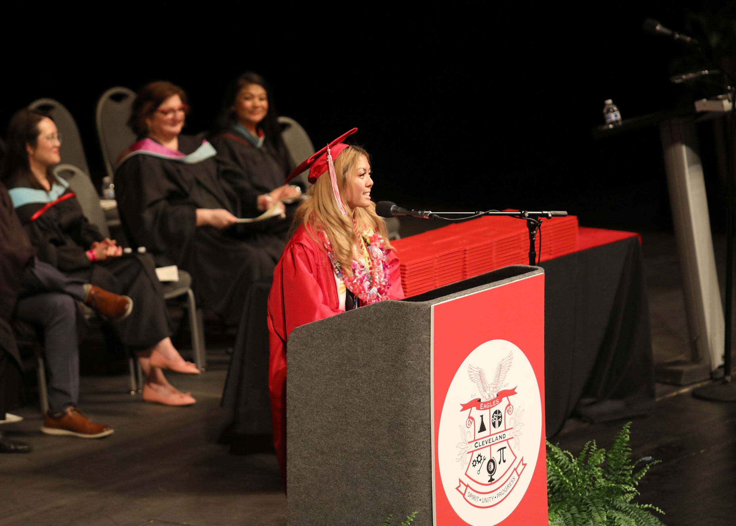Graduation Cleveland President speaking at the poduium