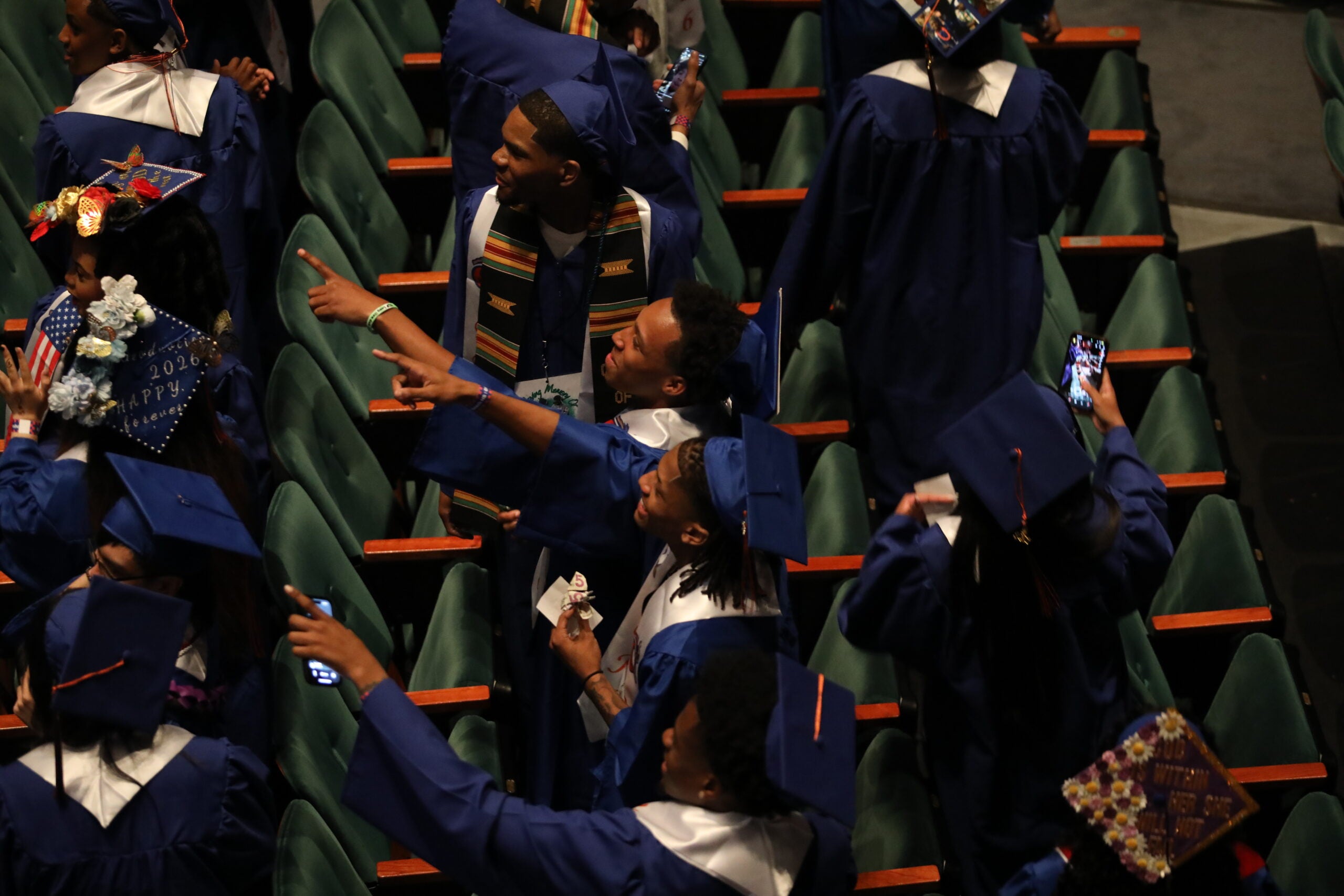 Graduation Rainier Beach pointing from audience