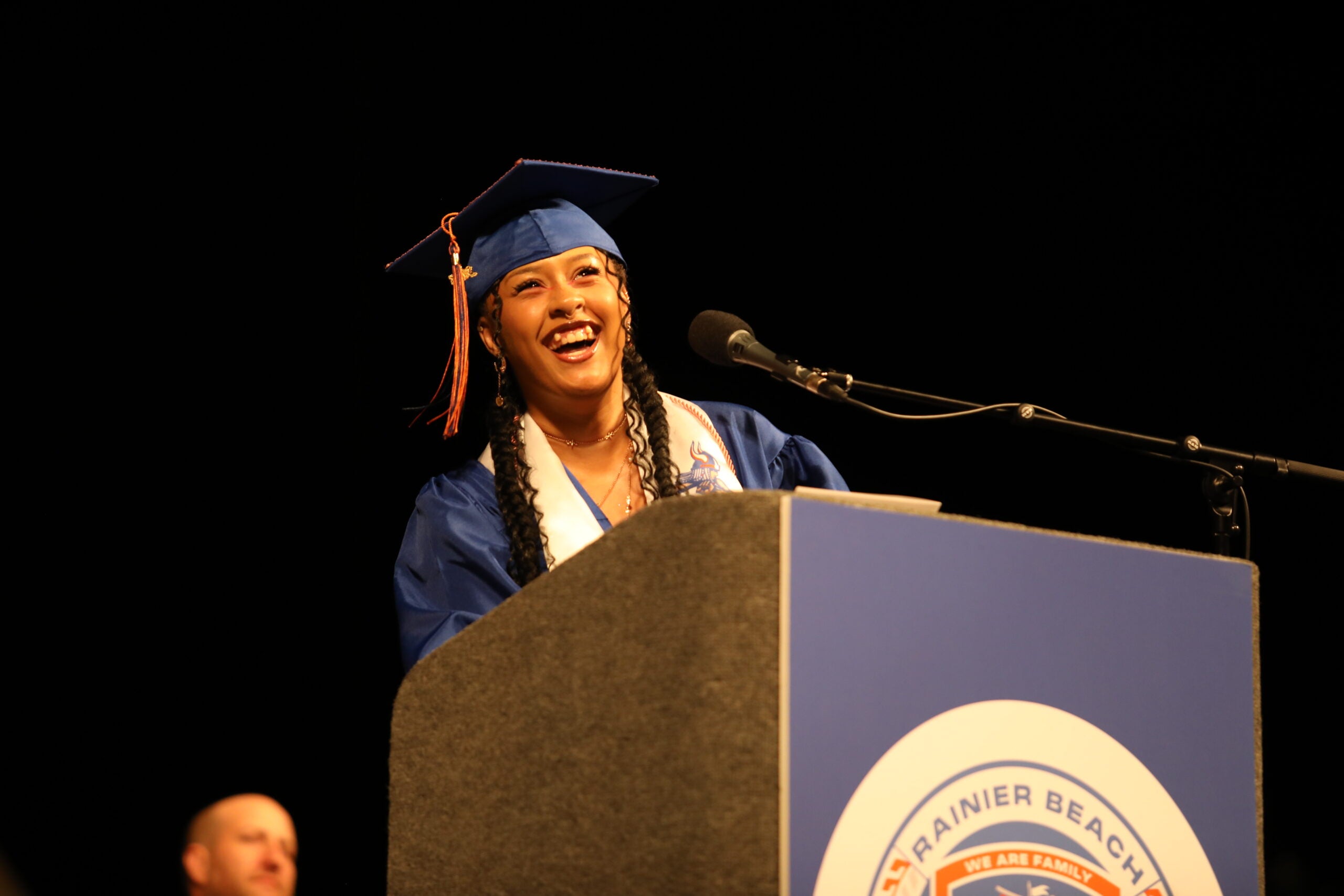 Graduation Rainier Beach spoken word at podium