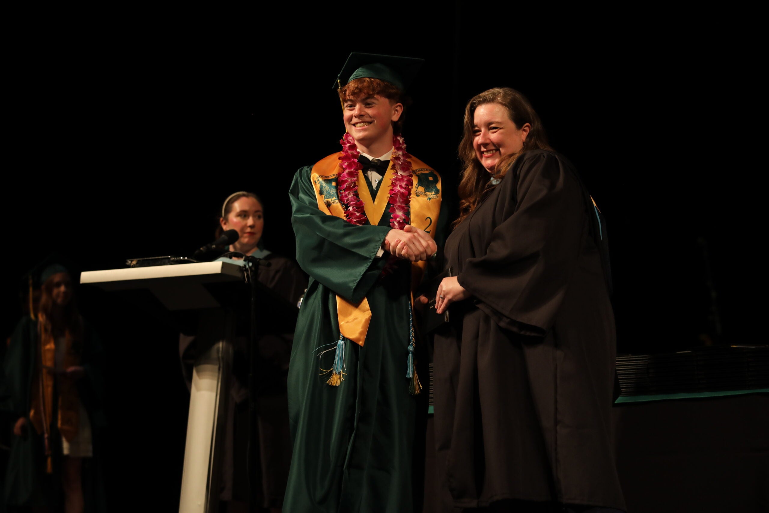 Graduation Roosevelt Graduate receives diploma