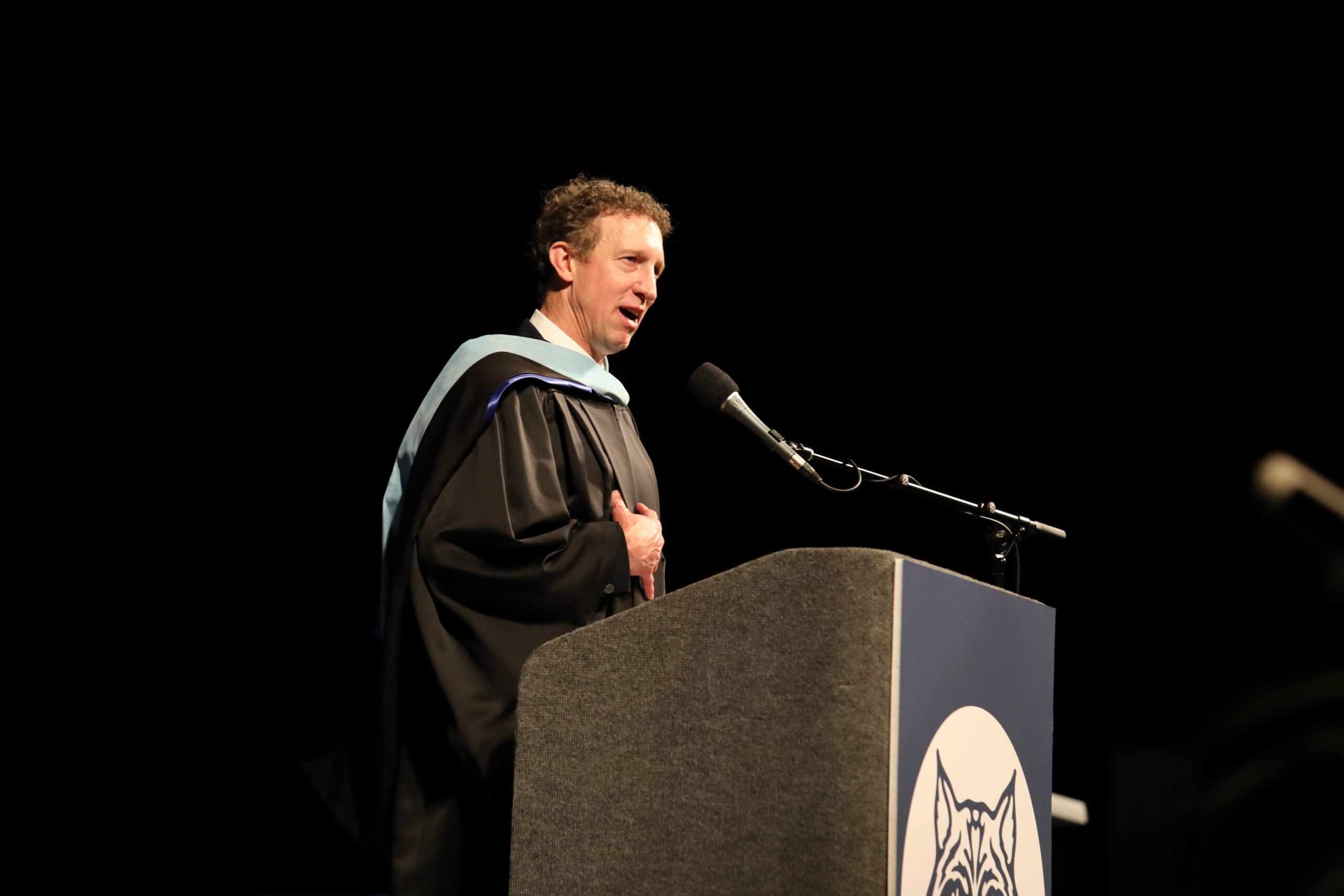 West Seattle Graduation speaker at podium