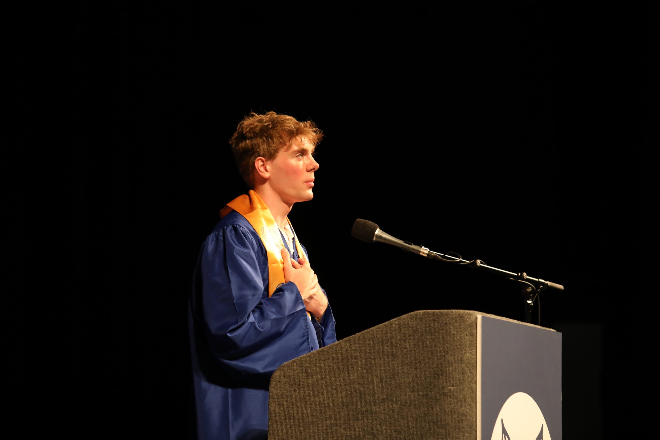 West Seattle Graduation speaker at podium