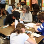 Teacher Crossman teachers math to students.