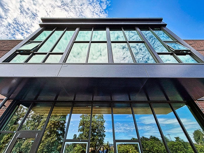 exterior view of two stories of a building with windows