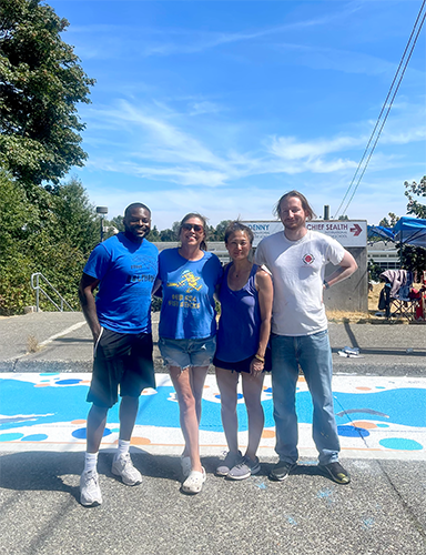 Staff working on painting