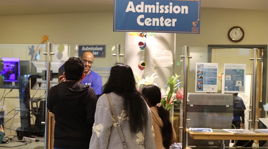 SPS enrollment team staff talking to prospective students and families at the January 2026 Enrollment Fair