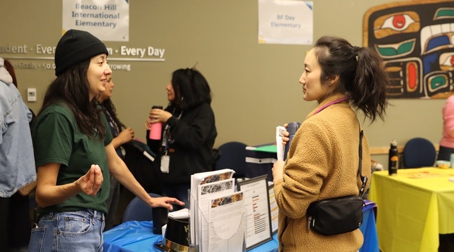 Beacon Hill staff talking to prospective students and families at the January 2026 Enrollment Fair