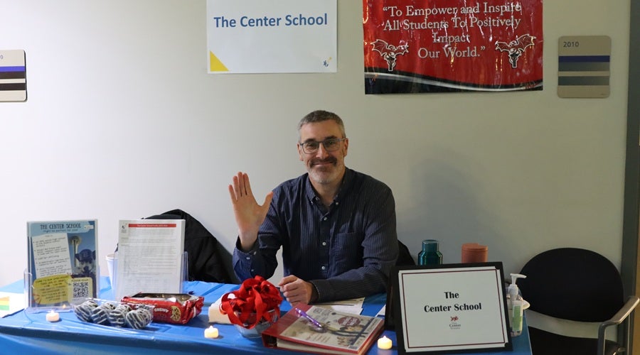 Center School staff member at a table at the January 2026 Enrollment Fair