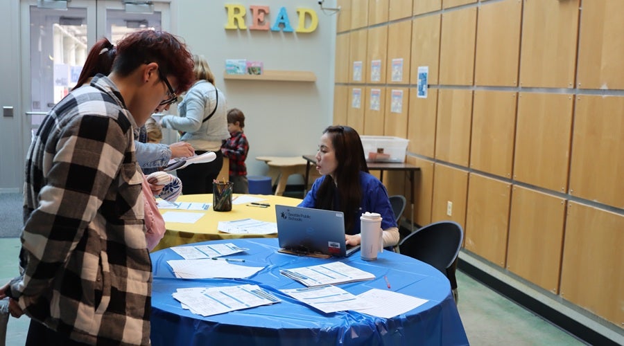 Enrollment team staff talking to prospective students and families at the January 2026 Enrollment Fair