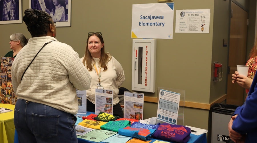 Sacajawea staff talking to prospective students and families at the January 2026 Enrollment Fair