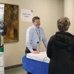 Seattle Skills Center Principal Dan Golosman talking to a prospective family at the January 2026 Enrollment Fair