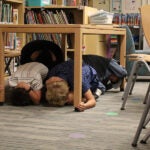 Great ShakeOut students practicing under desk
