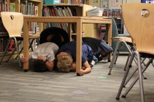 Great ShakeOut students practicing under desk