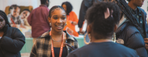 Student talking to a college rep at the Seattle Black College Expo