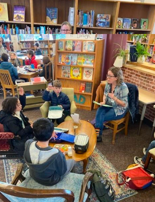 students and staff in the library