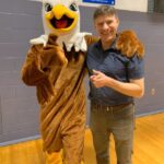 Principal Doug Sohn and Adams Eagle mascot
