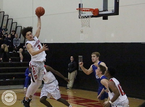 Cleveland basketball player jumping the air to grab the basketball