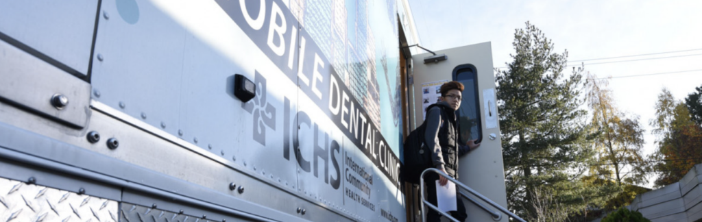 Mobile Dentist Bus with student on stairs