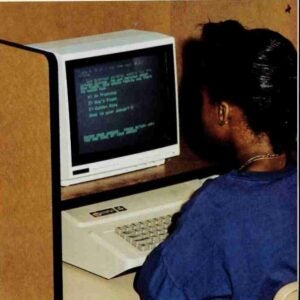 student at a desktop computer