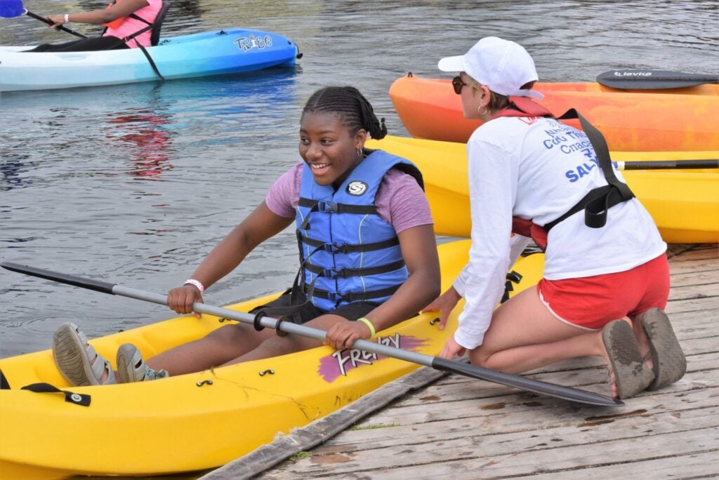 student and mentor kayaking