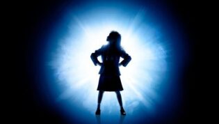 Girl shadow with white and blue light surrounding her.