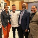 Aaron Smith, Chelsea Most, Chef Jet Tila, Dr. Brent Jones, and Dr. Powell standing in a kitchen