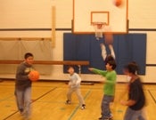 students playing basketball