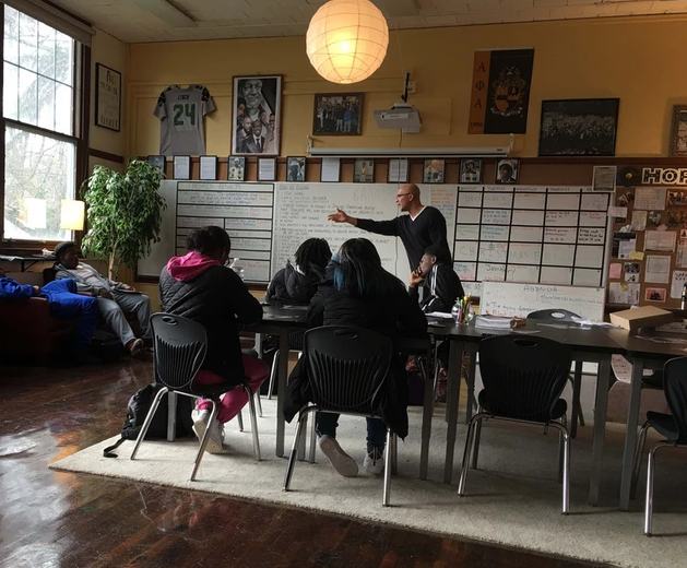 A teacher in a classroom with students