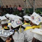 IA graduates with hats