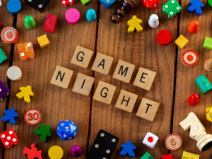 Game night event graphic with game pieces