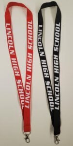 Red and black lanyards with Lincoln High school spelled out