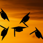 graduation caps thrown in the air